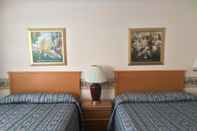 Kamar Tidur Alpine Motel