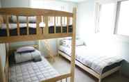 Kamar Tidur 7 Twin Rabbit Guesthouse