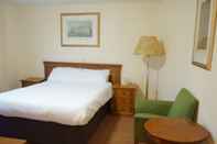 Kamar Tidur Corner House Hotel