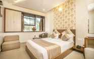 Bedroom 2 Aishwarya Suites