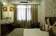 Bedroom 7 Aishwarya Suites