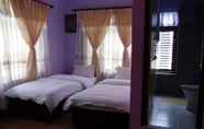 ห้องนอน 6 Dipankara Holiday Home