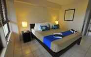 Kamar Tidur 7 Oasis Palms Hotel