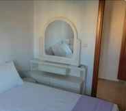 Kamar Tidur 4 Chrysiida Luxury Suites