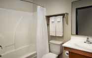 In-room Bathroom 4 WoodSpring Suites Louisville Jeffersontown