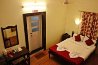 Phòng ngủ The Caravela Homestay