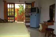 Kamar Tidur Palm Groove Guest House