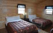 Bedroom 2 Roosevelt Inn and Suites