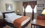 Bedroom 4 Roosevelt Inn and Suites