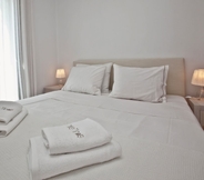 Bedroom 5 White Tinos Luxury Suites