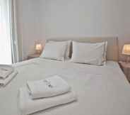 Bedroom 5 White Tinos Luxury Suites