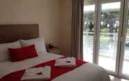 Kamar Tidur 5 Huskisson Beach B&B