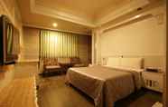 Bedroom 6 Taoyuan Hua Yue Hotel