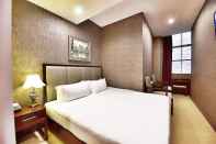 Kamar Tidur Megaboom City Hotel