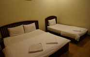 Kamar Tidur 4 Sinnakhone Hotel