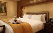 Kamar Tidur 3 Helnan Landmark Hotel