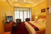 Kamar Tidur White Orchid Hotel