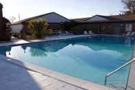 Swimming Pool At Home Inn & Suites