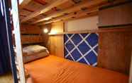 Kamar Tidur 3 Yadoya Guest House Orange - Hostel