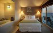 Bedroom 2 Tides Inn & Suites