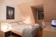 Bedroom Hôtel du Cheval Blanc - City Center