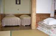 Kamar Tidur 2 Pension and Log Cottage Hoshinoko