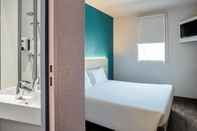 Bedroom hotelF1 St Witz A1 Paris Nord