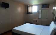 Bilik Tidur 3 RueMango Apartelle and Suites