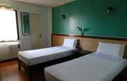 Kamar Tidur 4 RueMango Apartelle and Suites