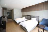 Bedroom Pinehills Hotel