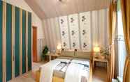 Bedroom 6 Ferienwohnungen & Gästezimmer Kachel