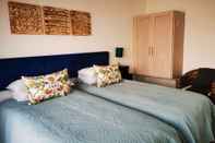 Kamar Tidur Bellamente Sirene Guesthouse