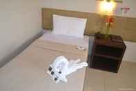 Kamar Tidur Columbus Plaza Hotel