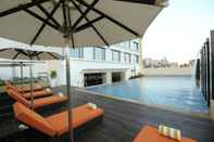 Swimming Pool Feathers - A Radha Hotel