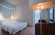 Bedroom 2 Grotta Palazzese Beach Hotel