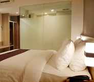 Kamar Tidur 4 The Evitel Hotel