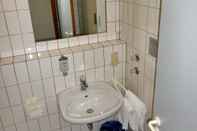 Phòng tắm bên trong Hotel Sehnder Hof