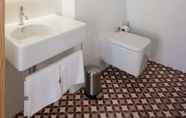 In-room Bathroom 6 Baumhaus Serviced Apartments