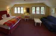 ห้องนอน 6 Factors Inn & Cottage