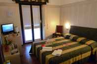ห้องนอน Hotel Montecarlo
