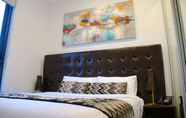 Kamar Tidur 5 Whitehorse Apartment Hotel