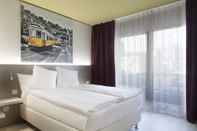 ห้องนอน Hotel City Locarno, Design & Hospitality