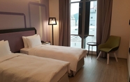 Kamar Tidur 4 Uinn Business Hotel - Taipei Shilin