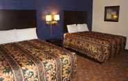 Bedroom 3 Coratel Inn & Suites by Jasper Waite Park