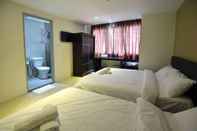 Kamar Tidur Swiss Cottage Hotel