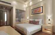 Bedroom 5 Sandal Suites Op. by Lemon Tree Hotels