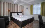 Bedroom 7 Le petit Palais – Hotel & Ferienapartments