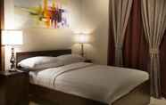 Kamar Tidur 3 Palms Lily Hotel Suites