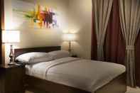 Kamar Tidur Palms Lily Hotel Suites