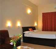 Kamar Tidur 6 Purple Hotels Resorts